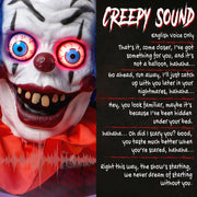 Close-up of the clown's face with glowing eyes and English-voice spooky sound effects