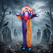 Animated clown decoration standing among gravestones in a graveyard display