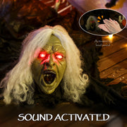 Close-up of the Outsunny zombie decoration's sound-activated glowing red eyes, triggered by clapping