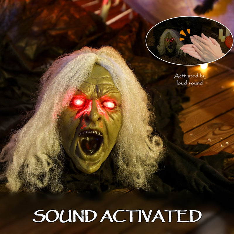 Close-up of the Outsunny zombie decoration's sound-activated glowing red eyes, triggered by clapping
