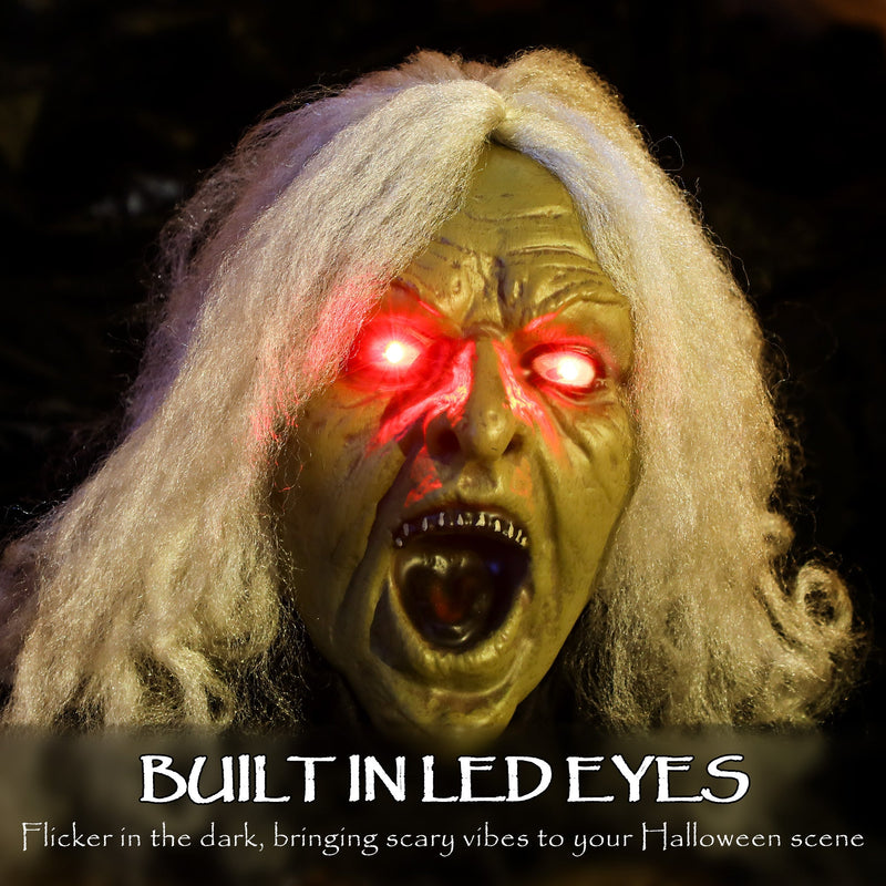 Close-up of the built-in LED eyes on the Outsunny Halloween zombie decoration's face