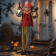 Outsunny animated Halloween clown decoration lit up on a porch doorway at night surrounded by pumpkins