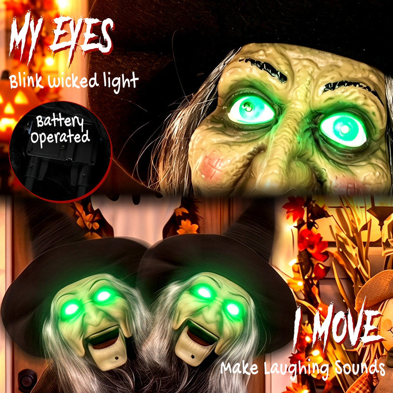 Close-up of the glowing green eyes and battery compartment with two witch heads shown moving