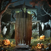 Outsunny hanging Halloween witch decoration lit up outside a house at night among pumpkins and ghost decor