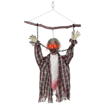 Animated hanging zombie decoration chained to a branch on plain background