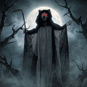Standing werewolf decoration silhouetted against a full moon and bare trees