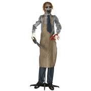 Khaki-aproned animated zombie prop standing upright holding a chainsaw and a severed hand