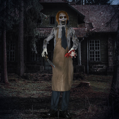 Zombie Halloween prop lit up at night outside a derelict house