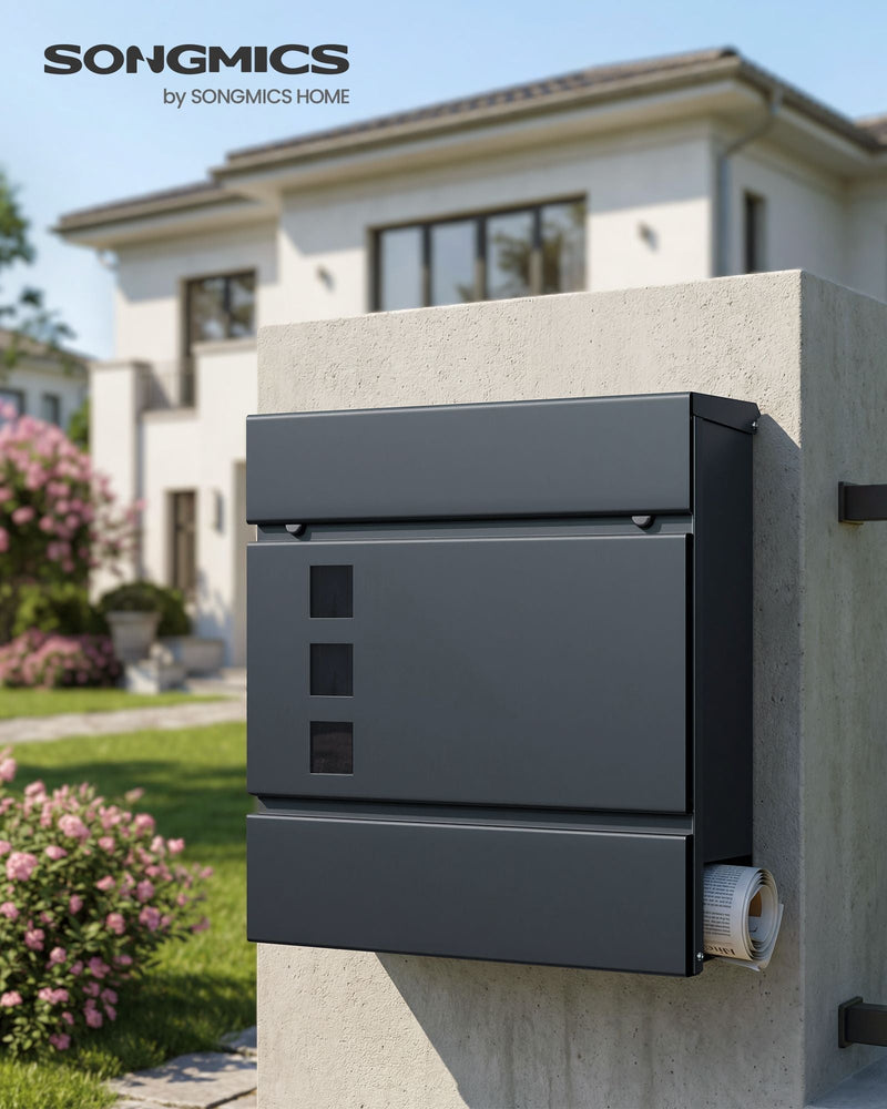 Mailbox fixed to a stone wall outside a house with a rolled newspaper in the holder