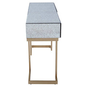 Side profile of the mirrored console table on its iron sledge base