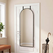 Arched full length mirror hung over a door beside an umbrella stand and bench