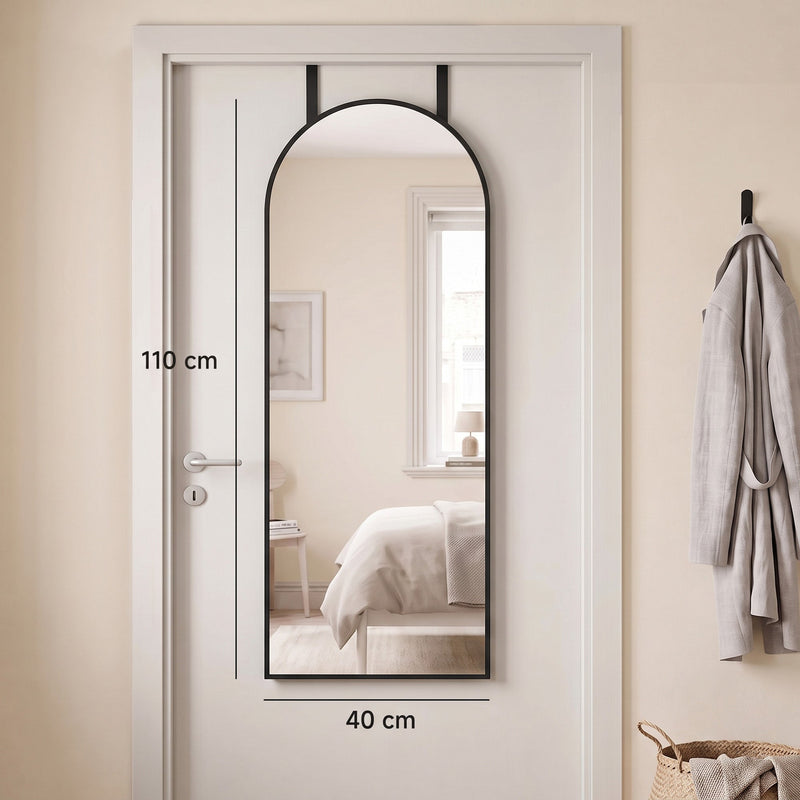 Arched mirror on a door with 110 cm height and 40 cm width marked