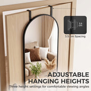 Arched mirror over a door with a close-up of the 3.5 cm hook spacing for three height settings