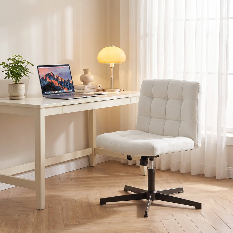 Beige Homcom office chair at a home desk with a laptop and lamp in the evening
