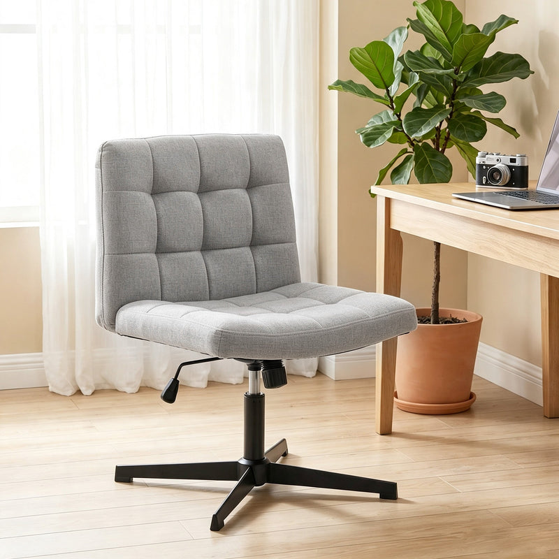 Grey Homcom office chair beside a home desk with a plant and camera, lifestyle setting