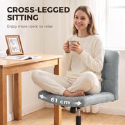 Woman sitting cross-legged on the grey Homcom office chair's 61 cm wide seat