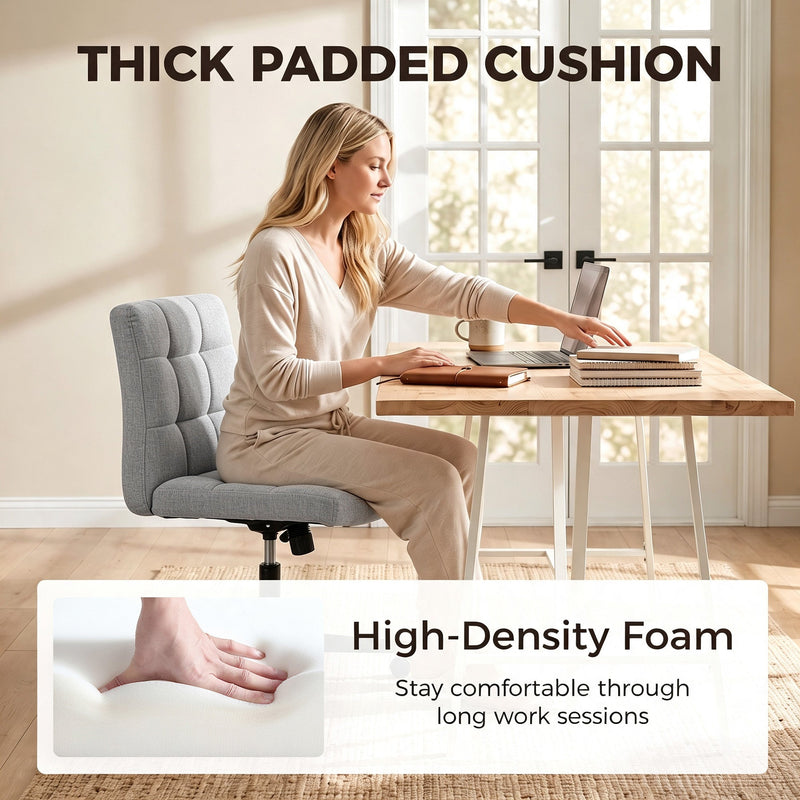Woman using a laptop on the grey Homcom office chair, highlighting the thick padded cushion