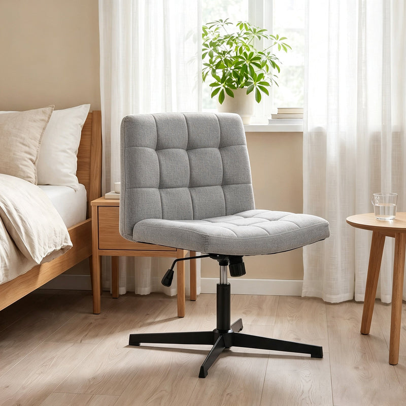Grey Homcom office chair beside a bed and window in a bedroom setting