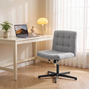 Grey Homcom office chair at a home desk with a laptop and lamp in the evening