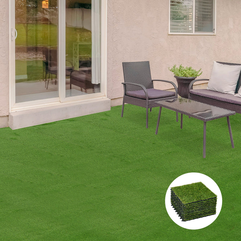 Artificial grass tiles laid on a patio beside rattan garden furniture