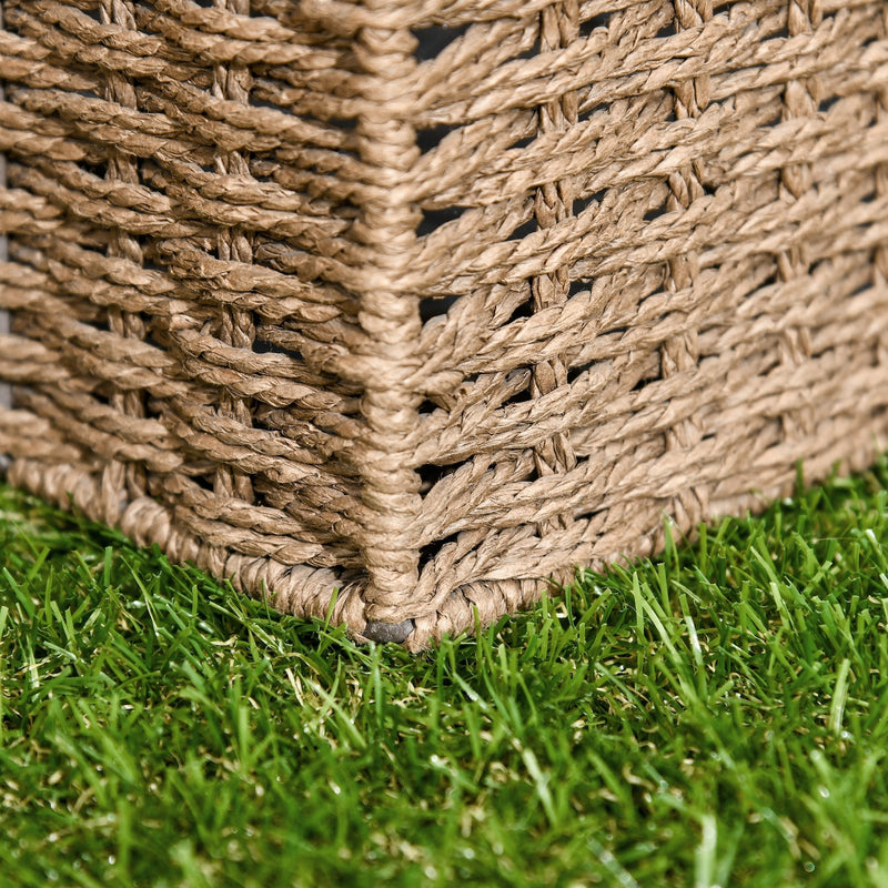 Close-up of a woven rattan basket corner standing on grass