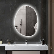 Asymmetric LED bathroom mirror, 80 x 60 cm: backlit above a basin in a dark marble bathroom