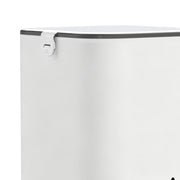 Close-up of the feeder's white hopper with grey lid and latch