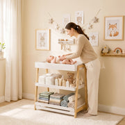 Baby changing table angled view showing shelves and corner protectors