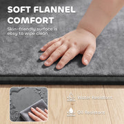 Baby hand on the soft grey flannel surface with water and oil resistant swatch