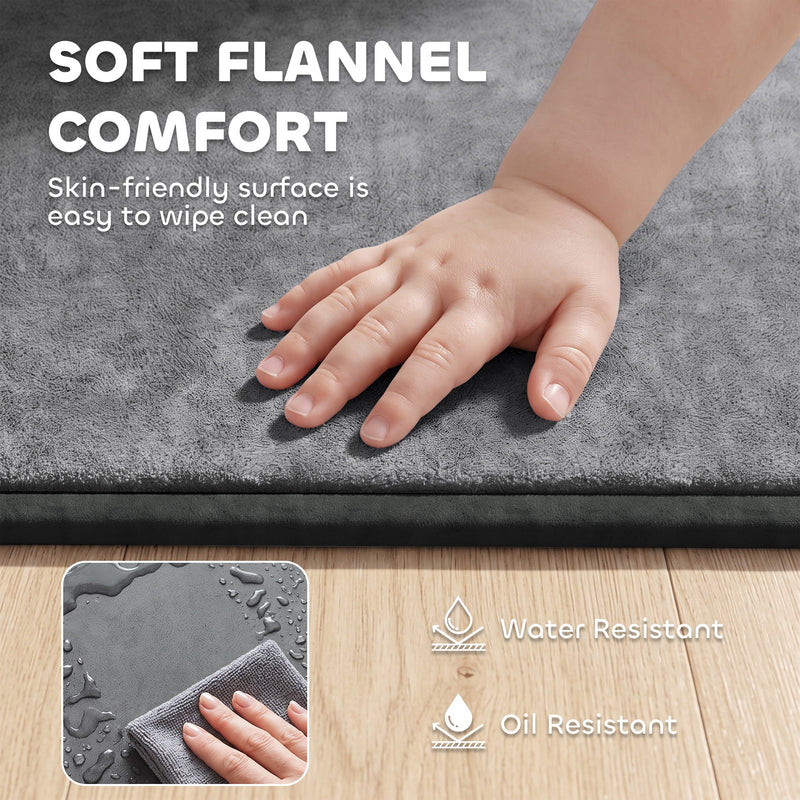 Baby hand on the soft grey flannel surface with water and oil resistant swatch
