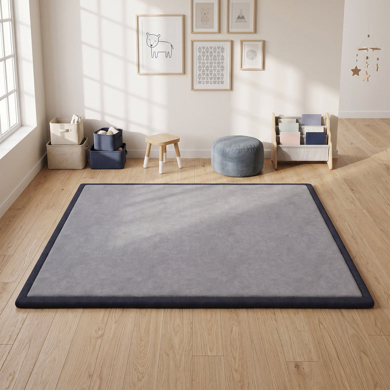 Grey play mat laid on a wooden floor in a bright children's playroom