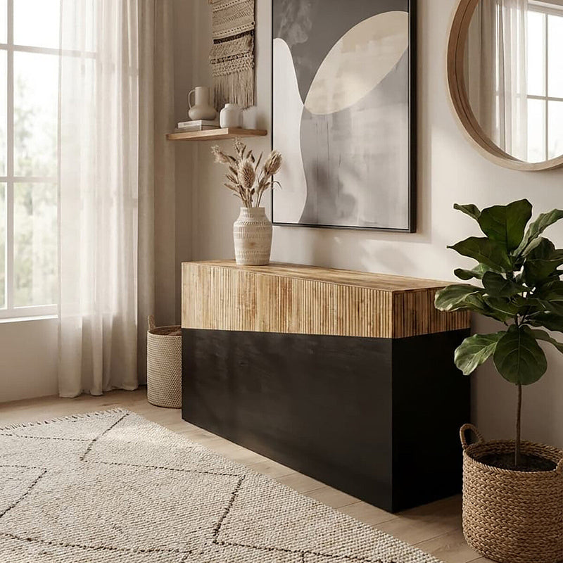 Narrow bamboo and black console table in a corridor with artwork above