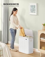White bamboo laundry basket with lid open showing 2 compartments