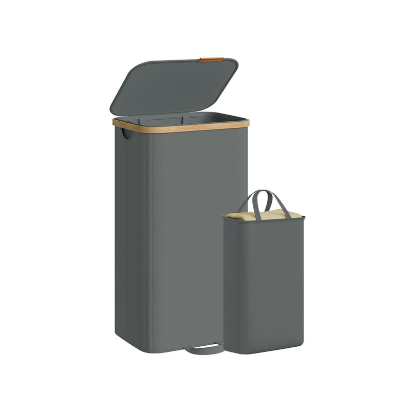 Slate grey laundry hamper with bamboo rim shown beside its removable liner