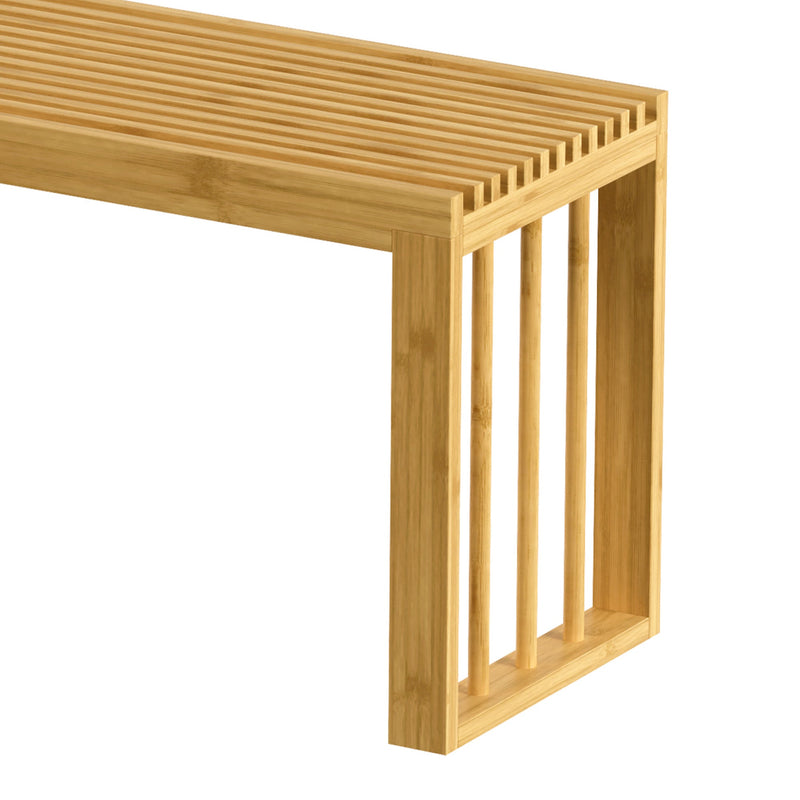 Close-up of the bamboo bench slatted top and rounded corner leg on a white background