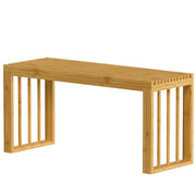 Natural bamboo shoe bench with slatted top and open sides on a white background