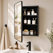 Black mirror cabinet with the door open showing black shelves filled with toiletries beside a basin