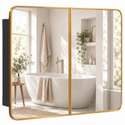 Gold tone framed double door bathroom mirror cabinet reflecting a bathtub and window