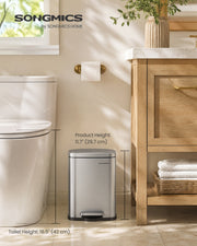5 L pedal bin beside a toilet and a light wood vanity unit, labelled 29.7 cm product height against a 42 cm toilet