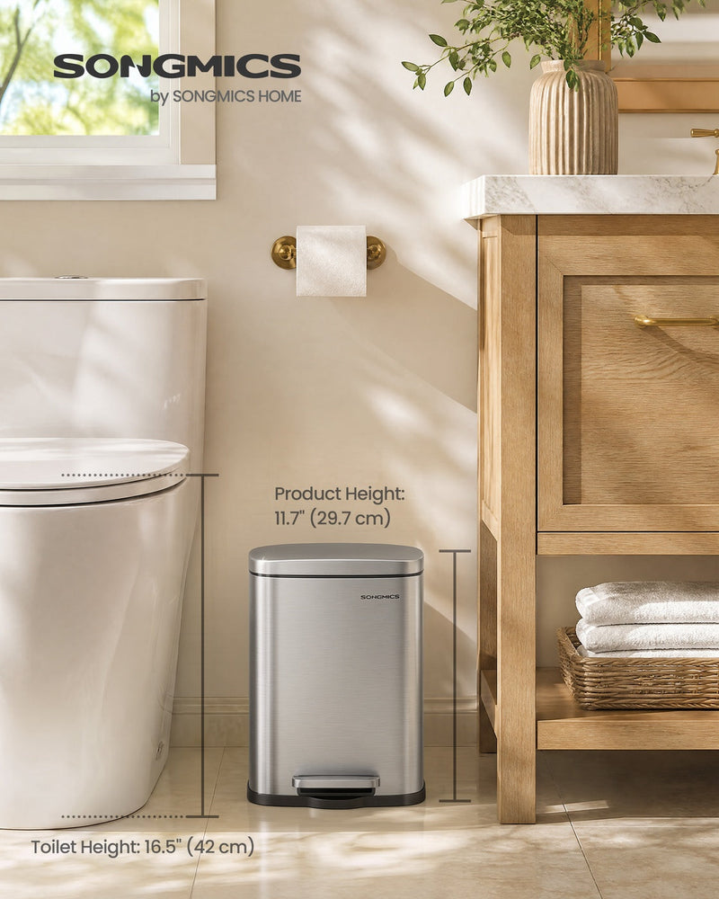 5 L pedal bin beside a toilet and a light wood vanity unit, labelled 29.7 cm product height against a 42 cm toilet