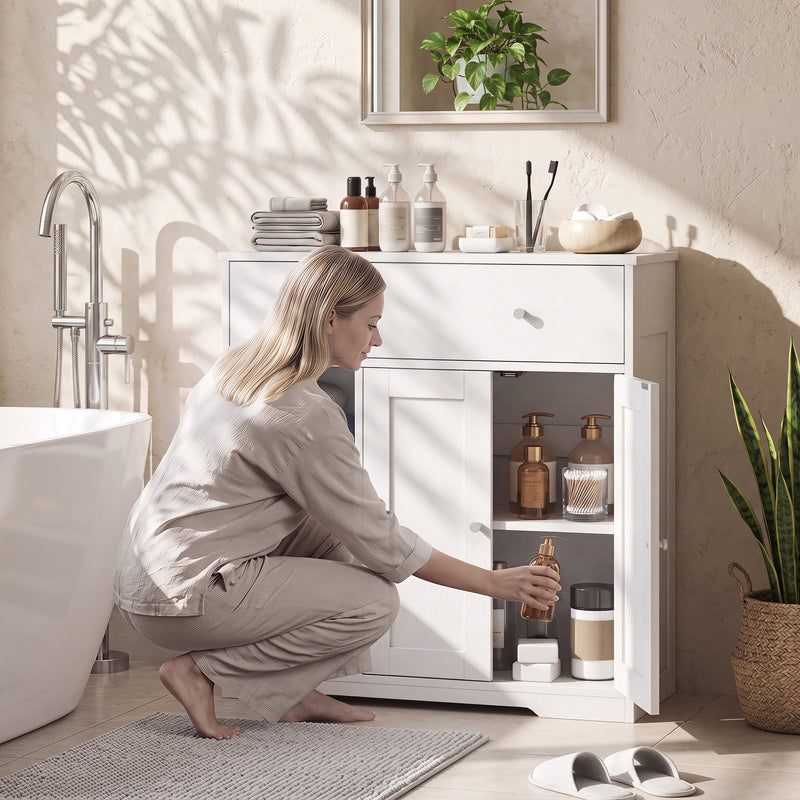 Woman crouching to take a bottle from the open cupboard section of the bathroom cabinet