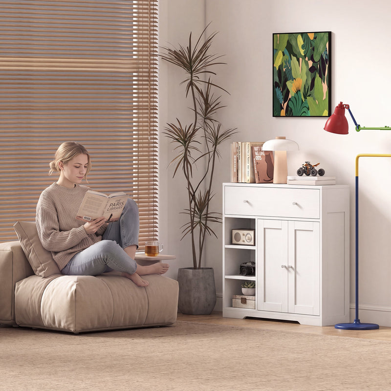 The white cabinet used as living room storage beside a reading chair and floor lamp