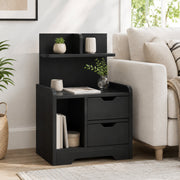 Black bedside table used as a living room side table next to a sofa