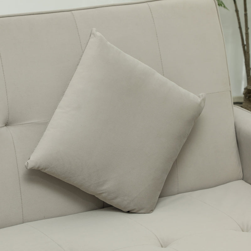 Close-up of two beige scatter cushions on the sofa back