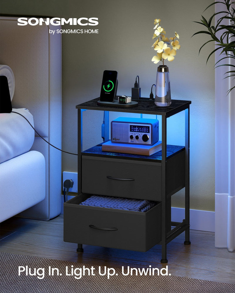 Close-up of the AC and USB charging ports, ink black BELLAH bedside table