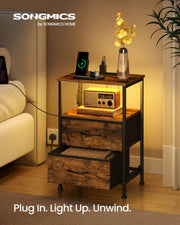 Close-up of the AC and USB charging ports, rustic brown BELLAH bedside table