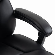 Close-up of the padded black PU armrest on the executive office chair