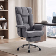 Dark grey massage office chair in a home office beside a bookcase and desk