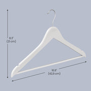 Birch wood coat hangers holding shirts in a wardrobe