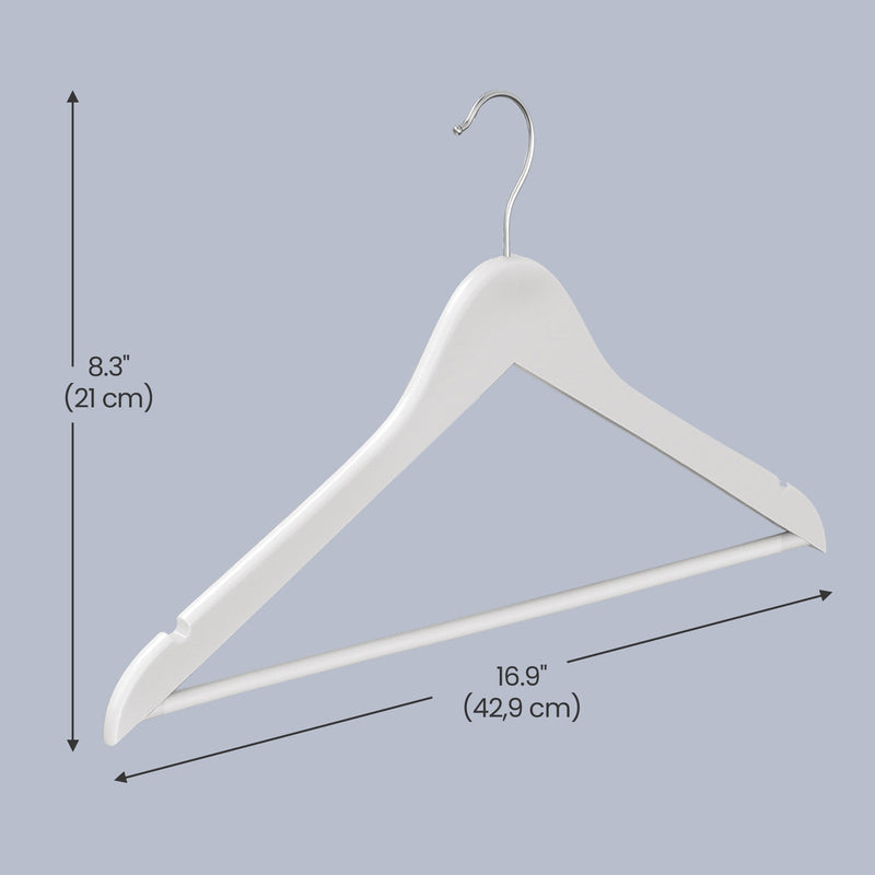 Birch wood coat hangers holding shirts in a wardrobe